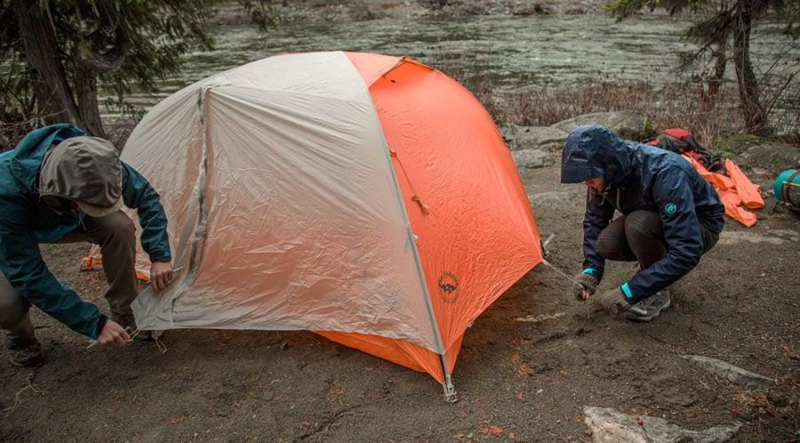 How do you set up a camping tent in the rain?